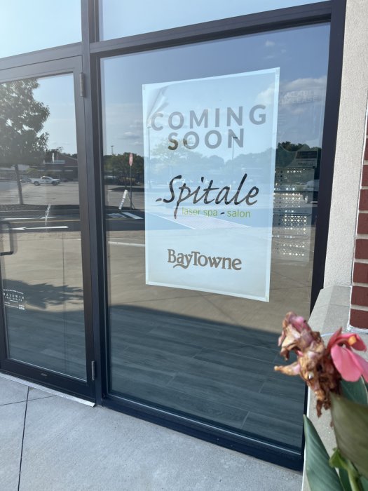 A coming soon sign for Spitale Laser Spa & Salon in BayTowne Plaza.